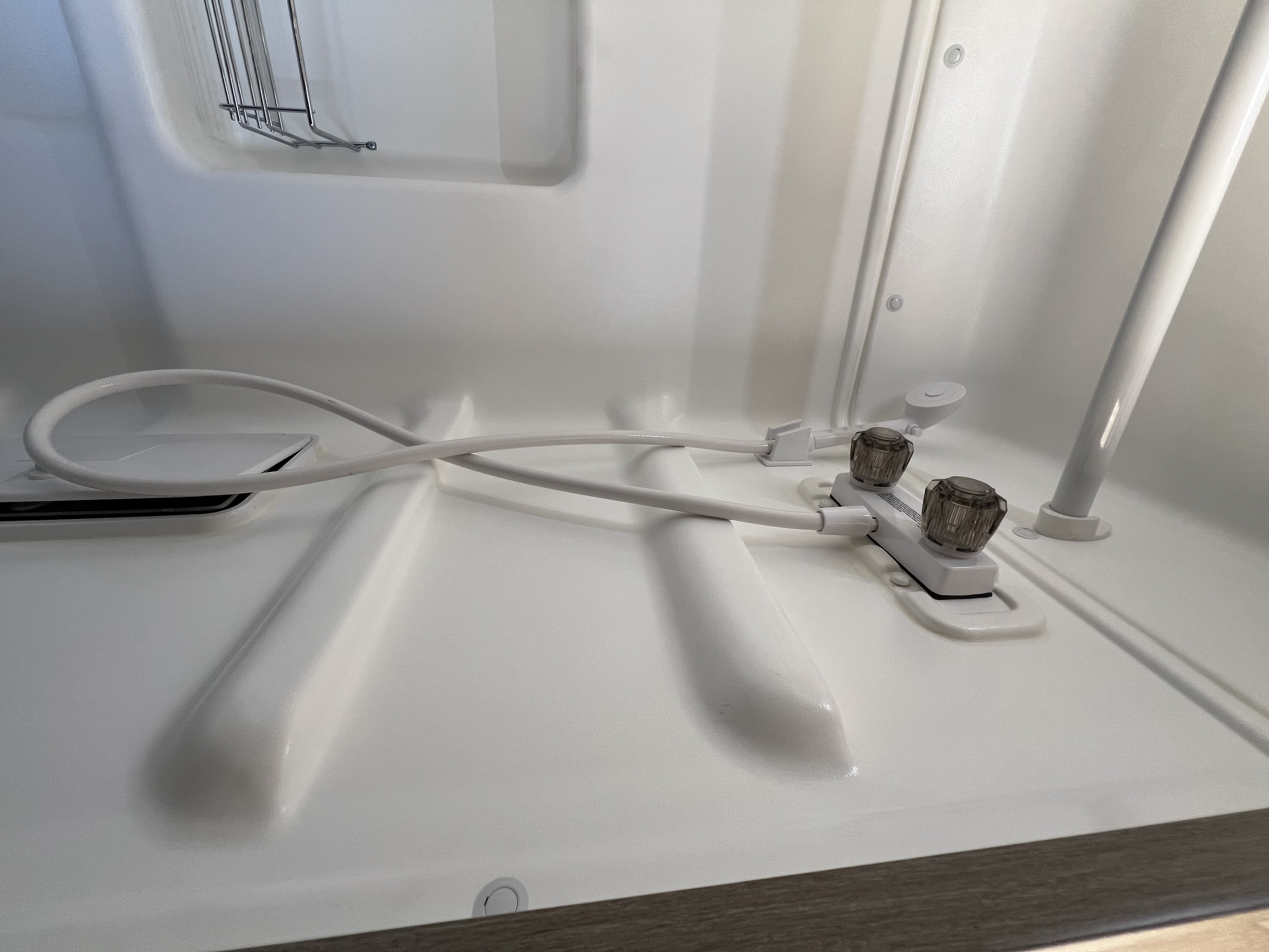 Nomadaya van illuminated at night at a quiet campsite